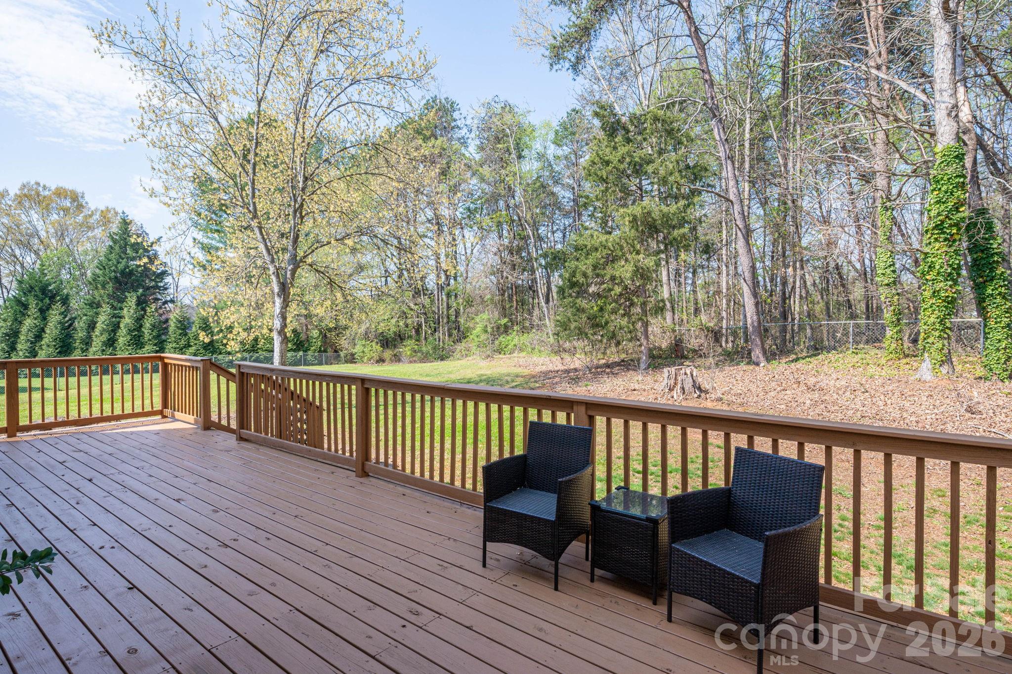 4503 Briar Creek Road Maiden, NC 28650 - Photo 40 of 48 a view of a wooden deck with furniture