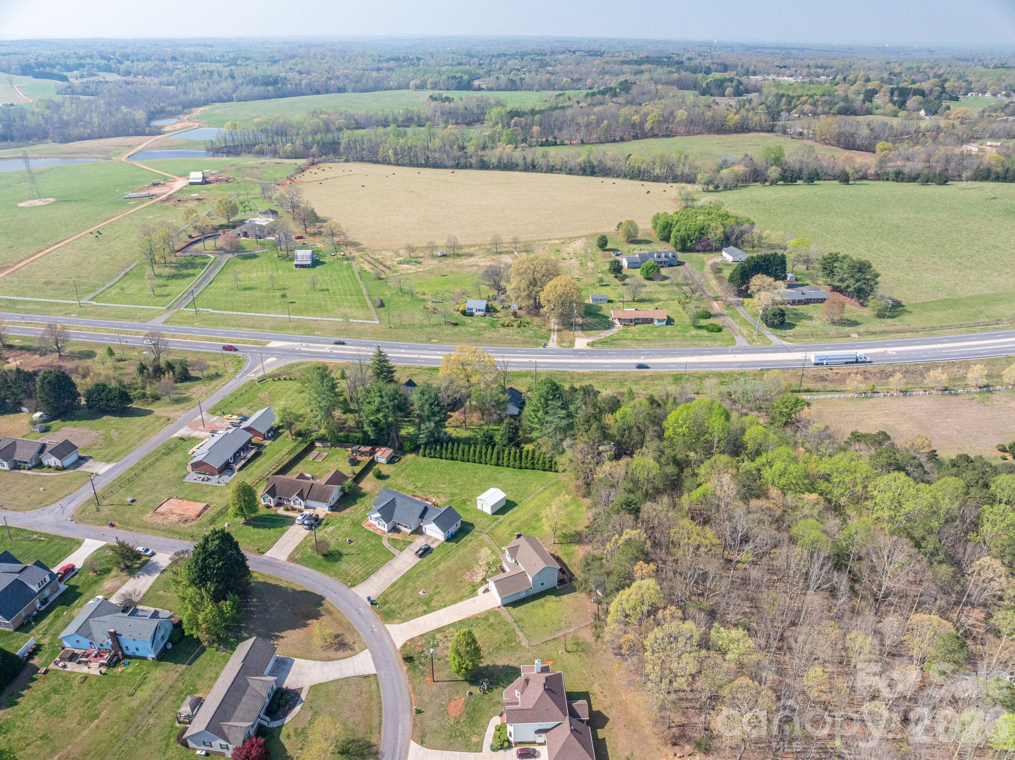 4503 Briar Creek Road Maiden, NC 28650 - Photo 46 of 48 an aerial view of a houses with a yard and lake view