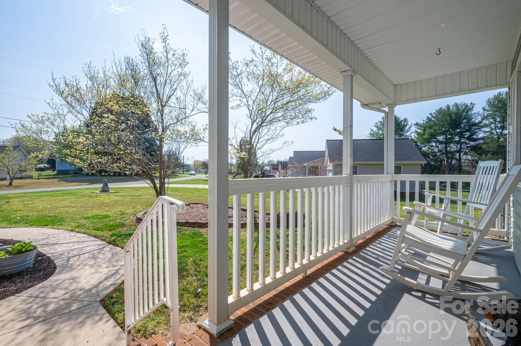 4503 Briar Creek Road Maiden, NC 28650 - Photo 5 of 48 a view of a deck with a big yard potted plants and large tree