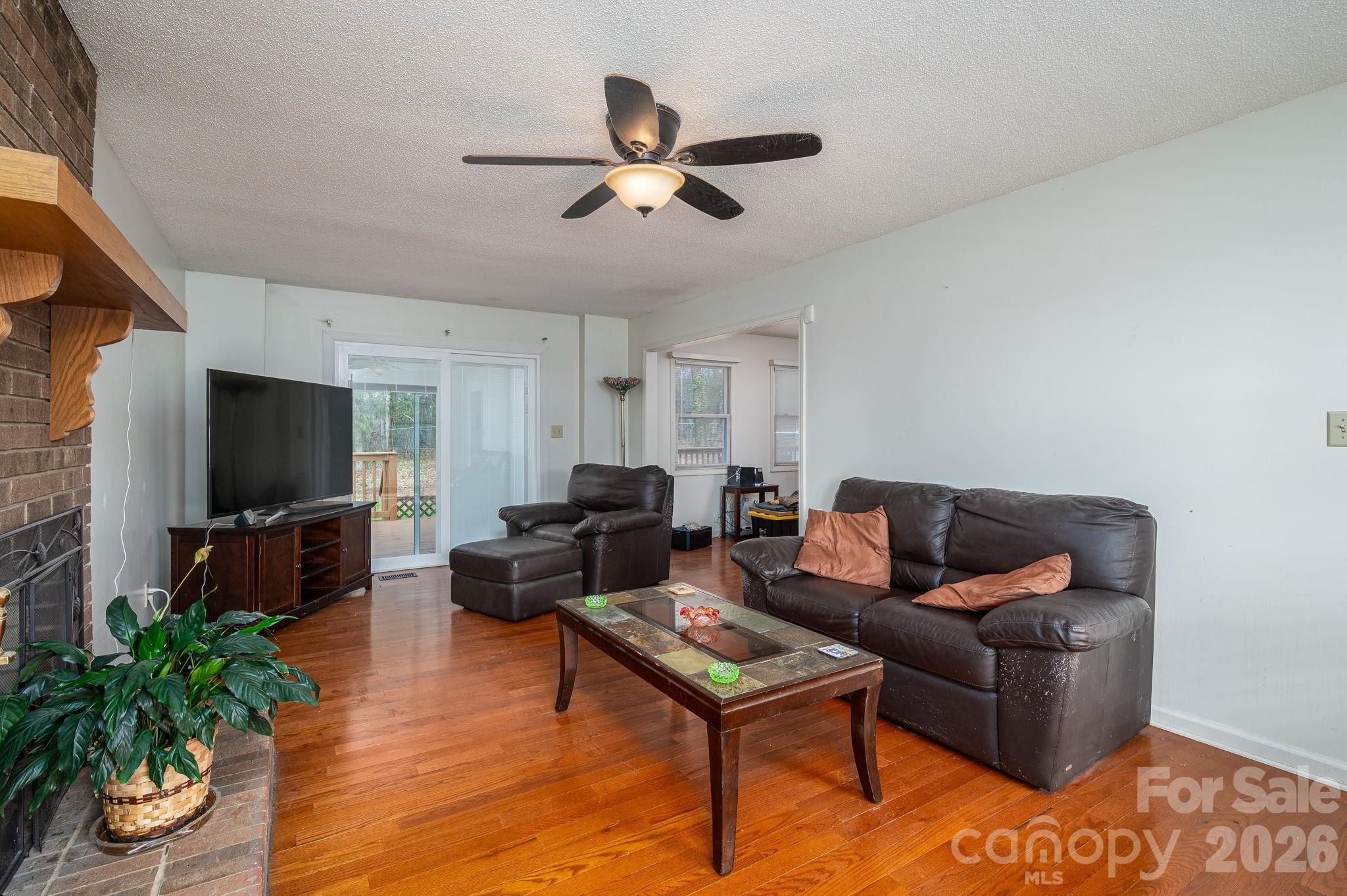 4503 Briar Creek Road Maiden, NC 28650 - Photo 6 of 48 a living room with furniture and a flat screen tv