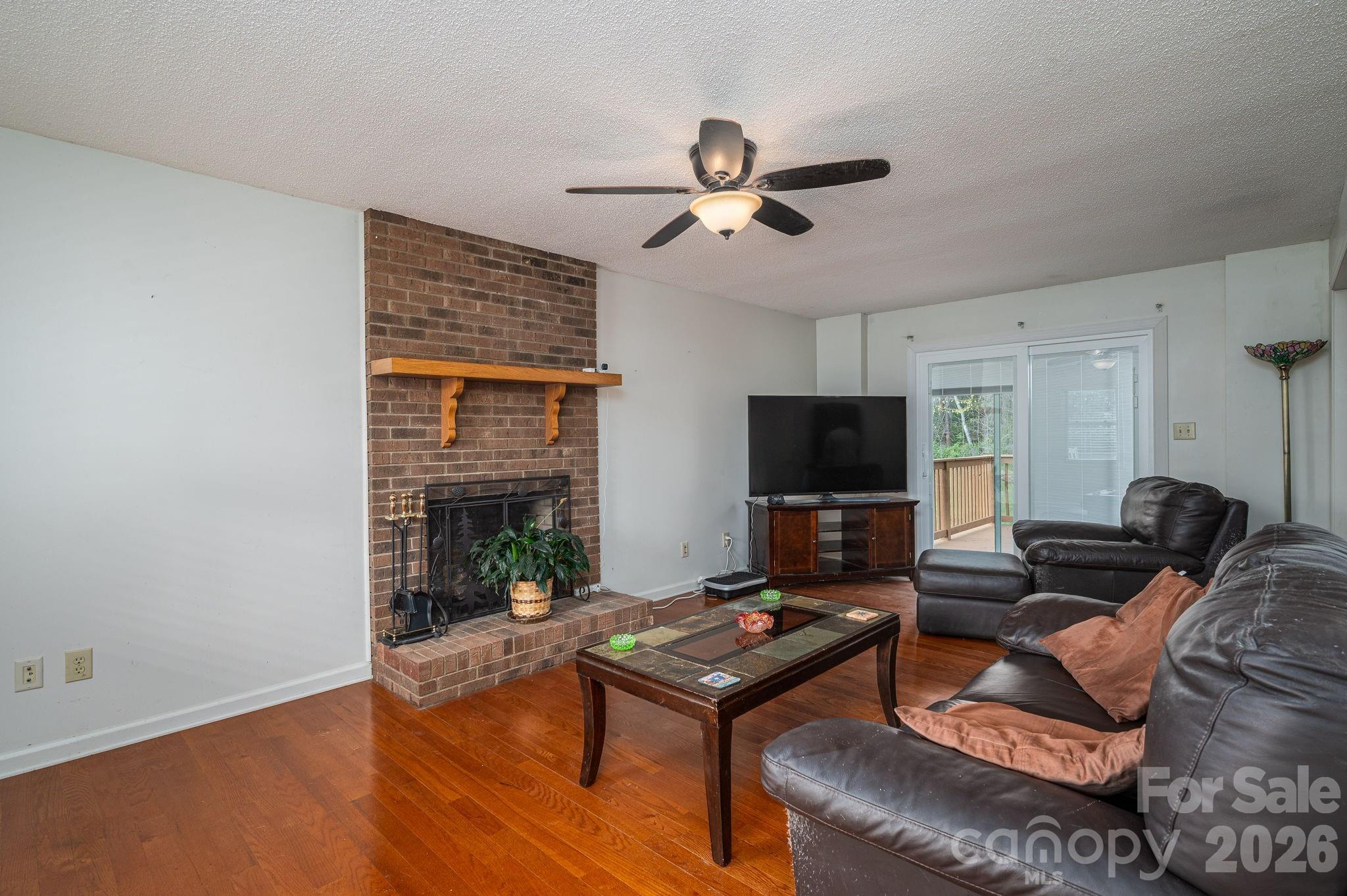 4503 Briar Creek Road Maiden, NC 28650 - Photo 7 of 48 a living room with furniture and a flat screen tv