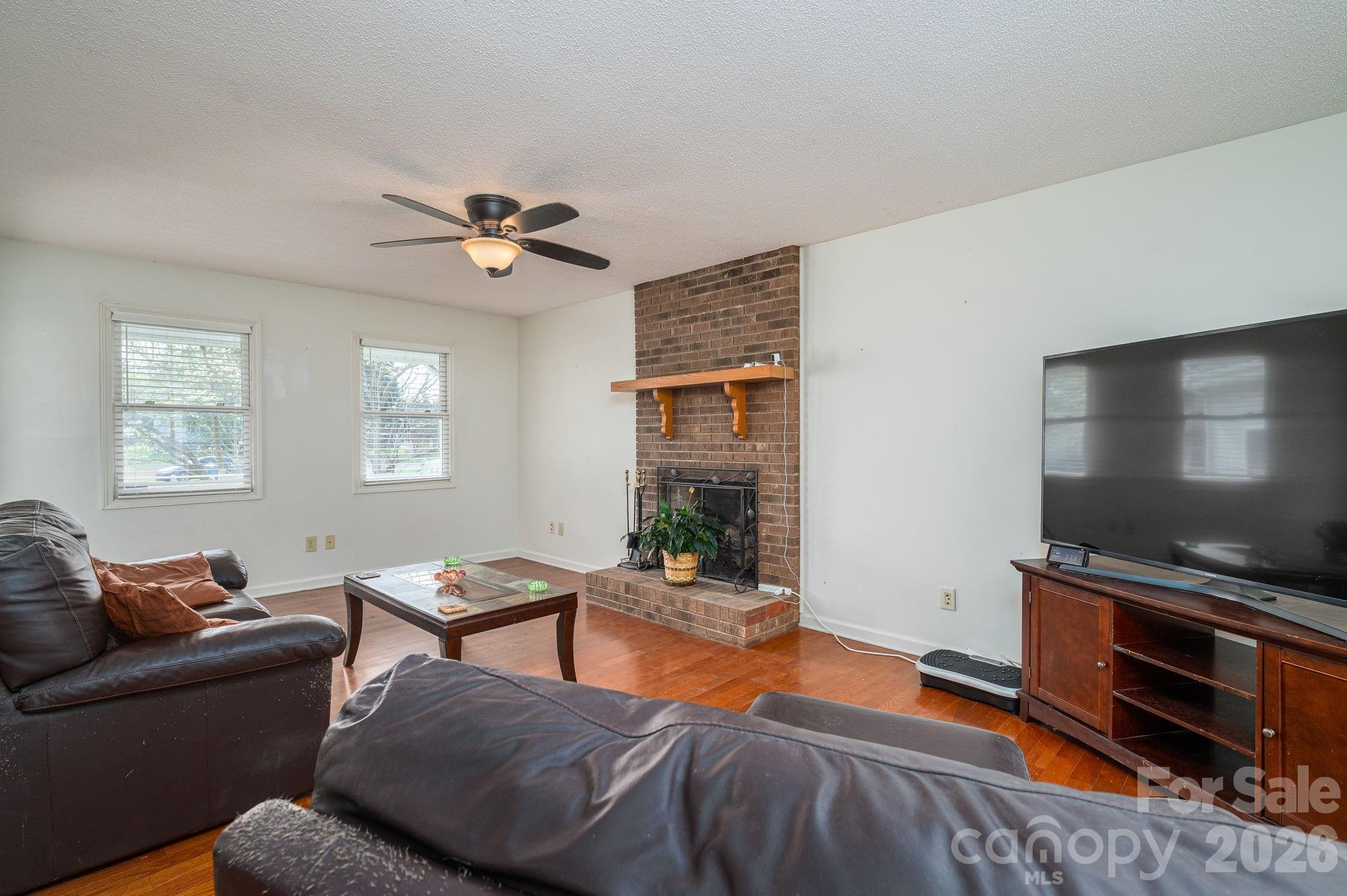 4503 Briar Creek Road Maiden, NC 28650 - Photo 8 of 48 a living room with furniture and a flat screen tv