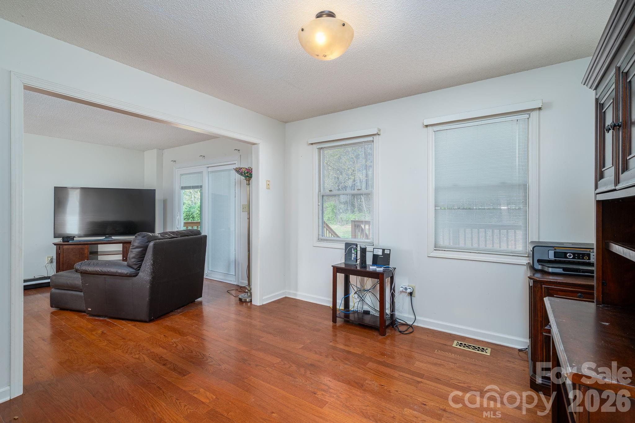 4503 Briar Creek Road Maiden, NC 28650 - Photo 9 of 48 a living room with furniture and a flat screen tv