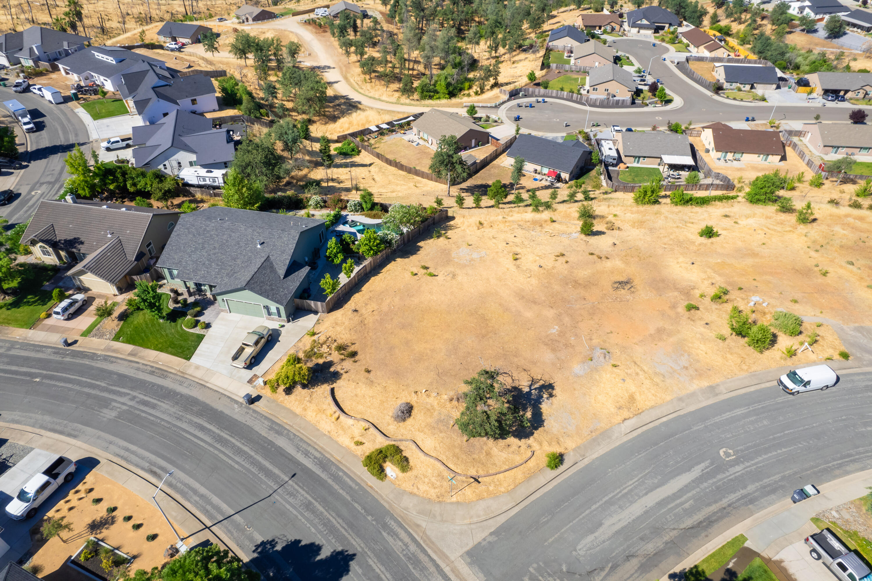 1400 White Water Circle Redding, CA 96003 - Photo 4 of 6 an aerial view of residential houses with outdoor space