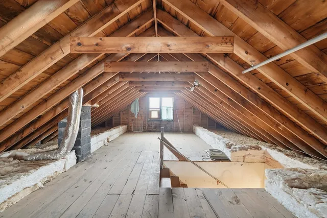 a view of a hall with wooden floor
