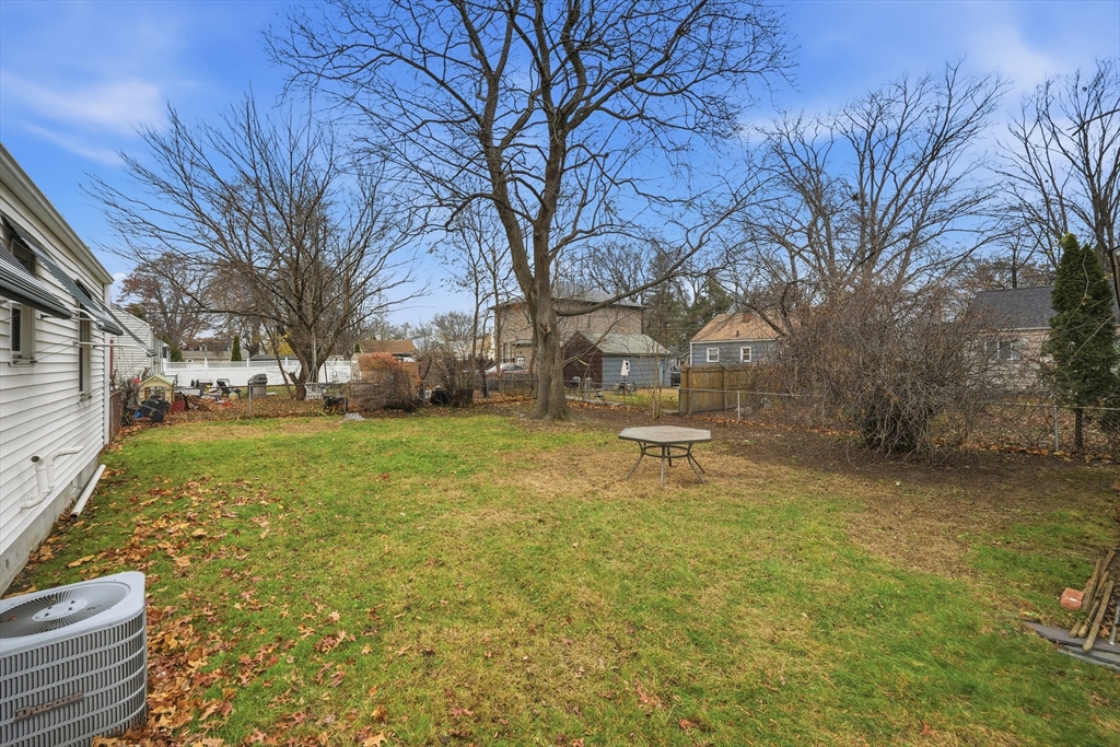 47 Holy Cross Street Springfield, MA 01104 - Photo 7 of 22 a backyard of a house with lots of green space