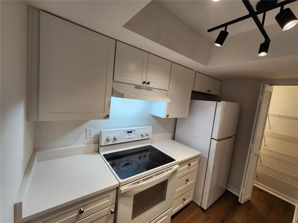 5823 Southwest 9th Place, Unit H55 Gainesville, FL 32607 - Photo 20 of 50 a kitchen with a refrigerator and a stove
