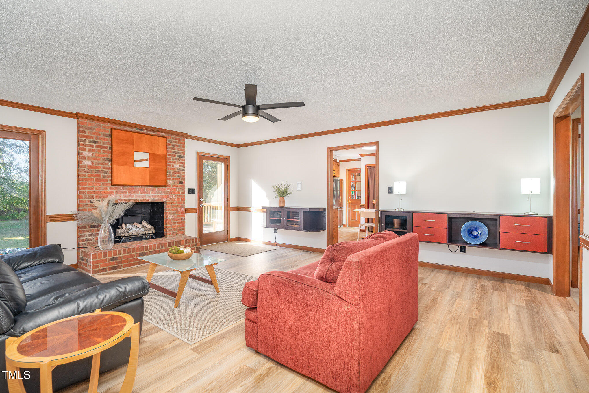 5820 Hampton Ridge Road Raleigh, NC 27603 - Photo 3 of 12 a living room with furniture and a large window