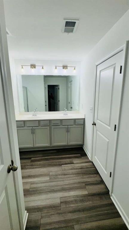 4078 Haleston Road Duluth, GA 30097 - Photo 10 of 25 a bathroom with a sink and mirror