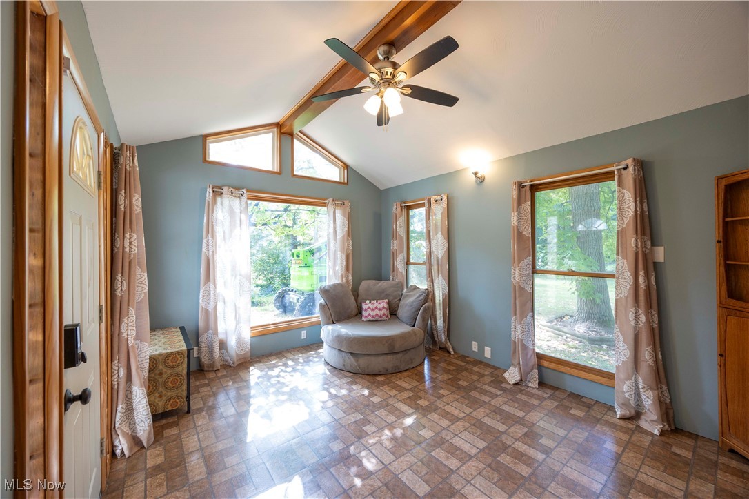 15724 Wyatt Road Cleveland, OH 44112 - Photo 9 of 47 Living area featuring healthy amount of natural light, brick patterned flooring, and ceiling fan