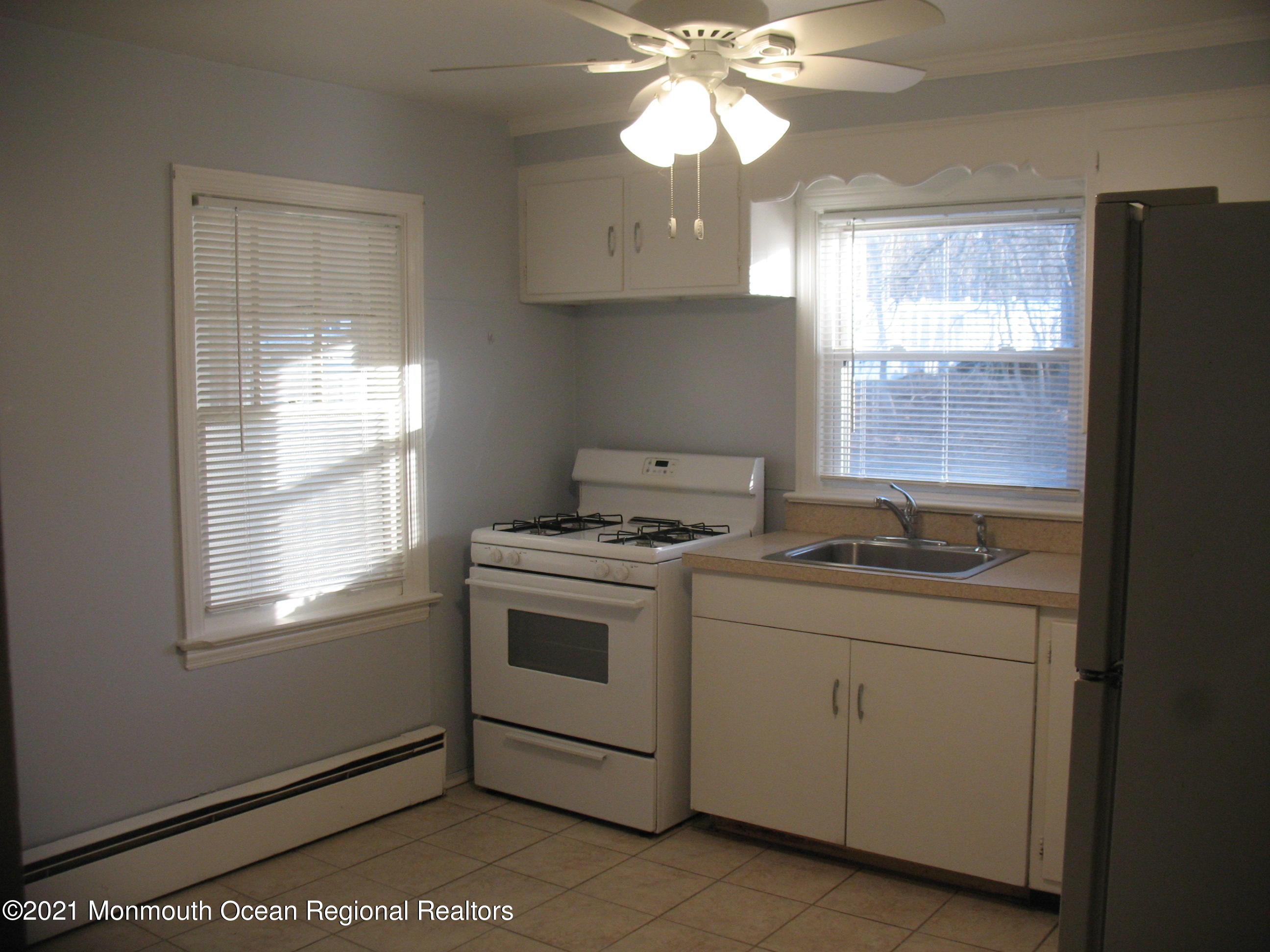 222 Windeler Road Howell, NJ 07731 - Photo 6 of 17 a kitchen with a stove and a microwave