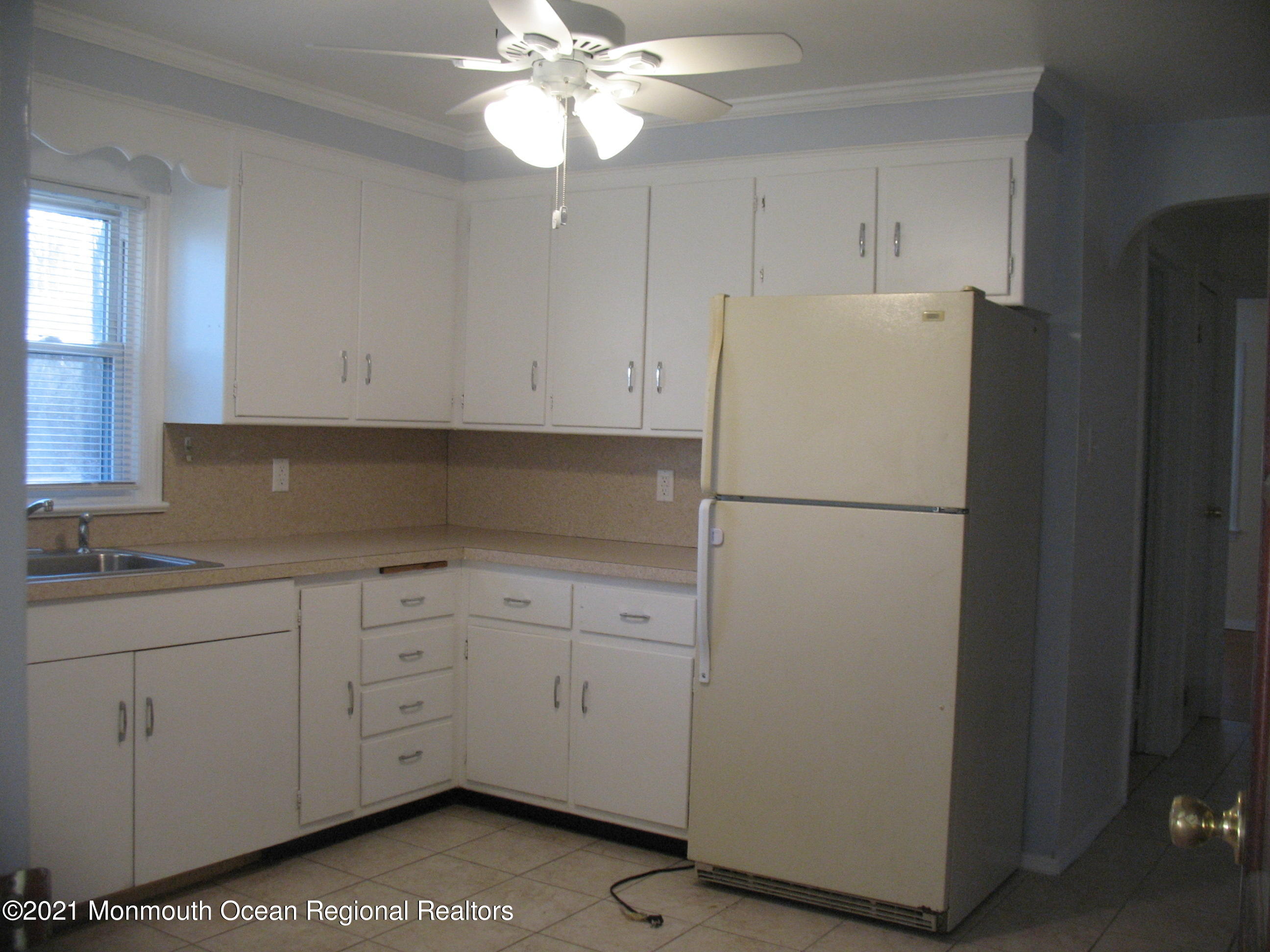222 Windeler Road Howell, NJ 07731 - Photo 7 of 17 a white refrigerator freezer sitting inside of a kitchen