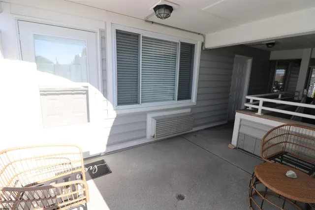 a view of bedroom with furniture and window