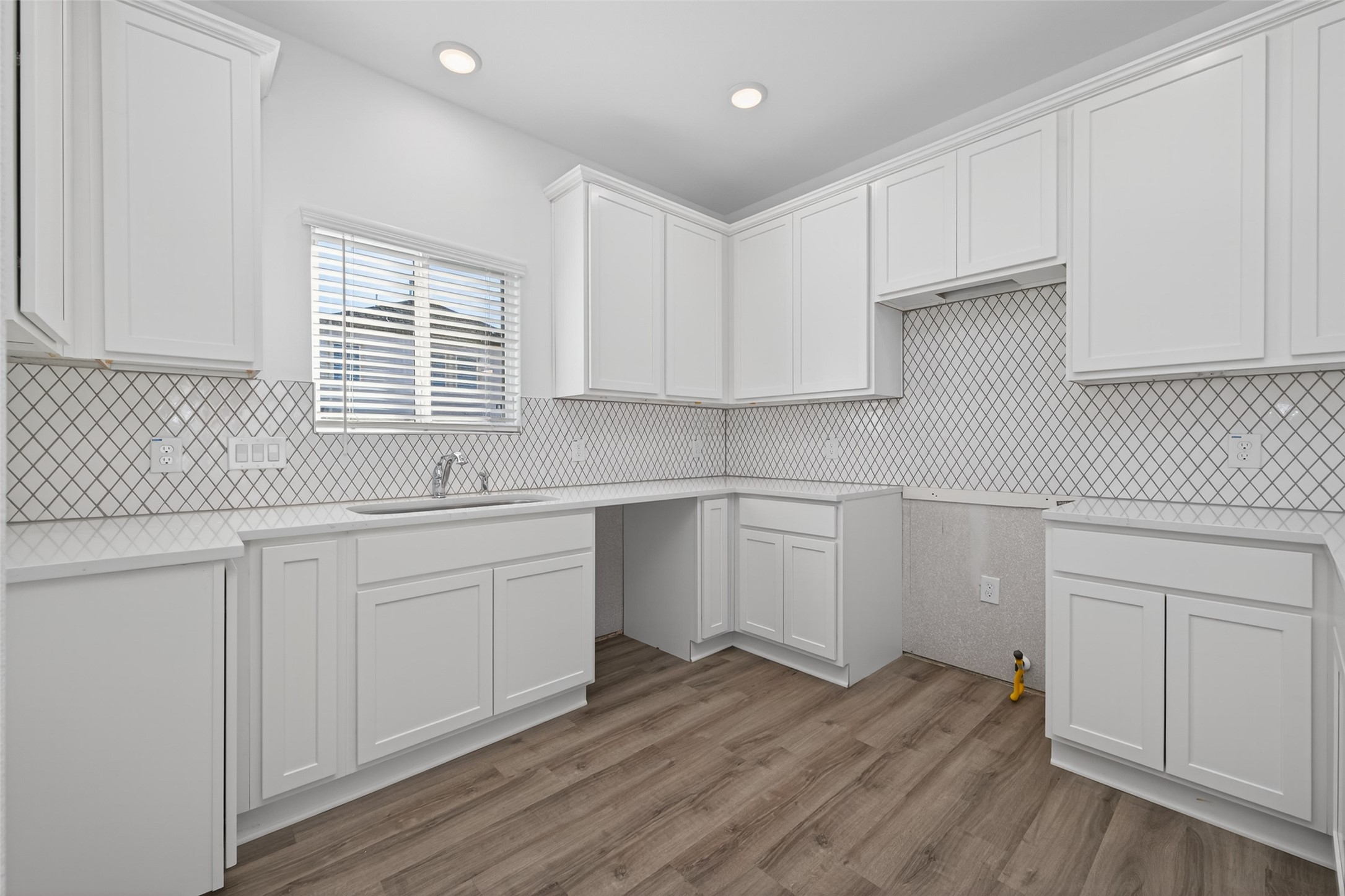 9718 Enclave Ridge Road Willis, TX 77318 - Photo 13 of 34 a kitchen with granite countertop white cabinets and white appliances