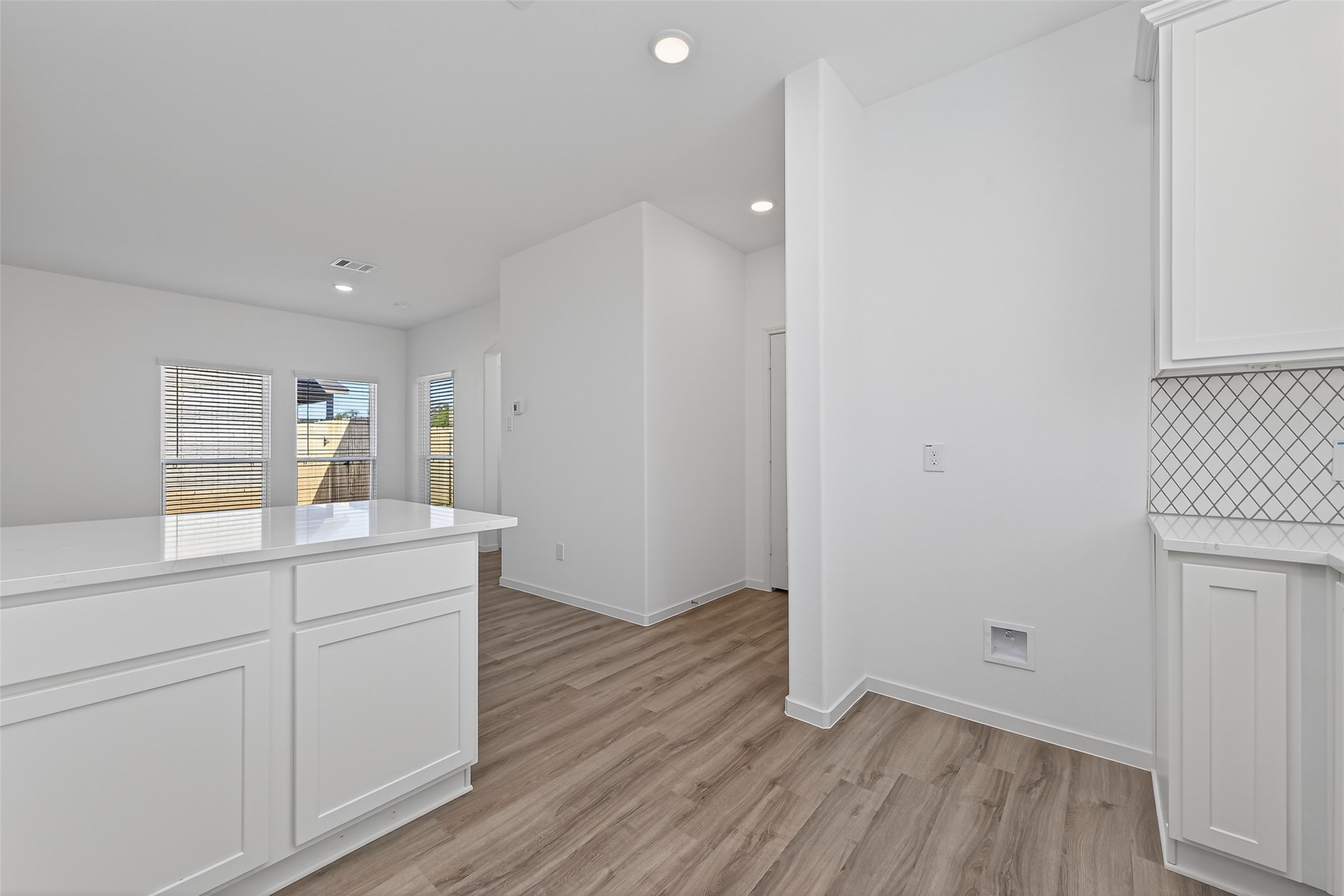 9718 Enclave Ridge Road Willis, TX 77318 - Photo 14 of 34 a room with white cabinets and wooden floor