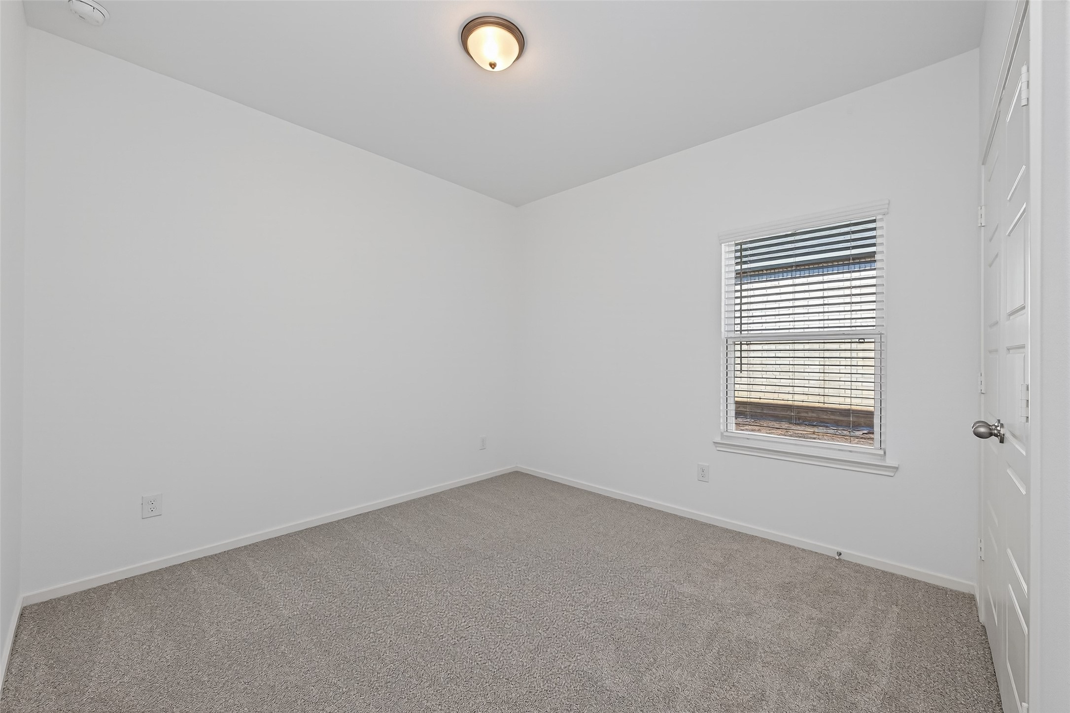 9718 Enclave Ridge Road Willis, TX 77318 - Photo 17 of 34 an empty room with a window