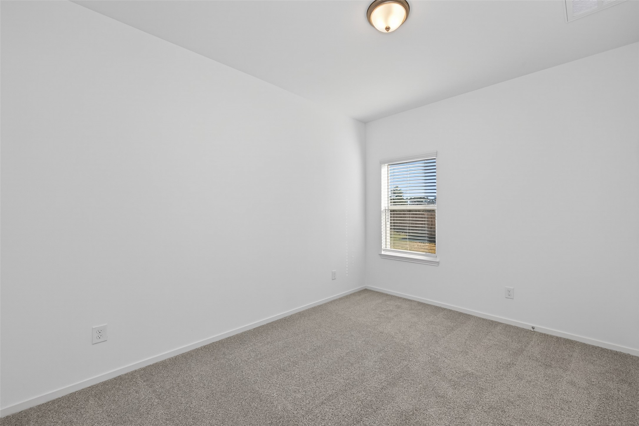 9718 Enclave Ridge Road Willis, TX 77318 - Photo 20 of 34 a view of an empty room with a window