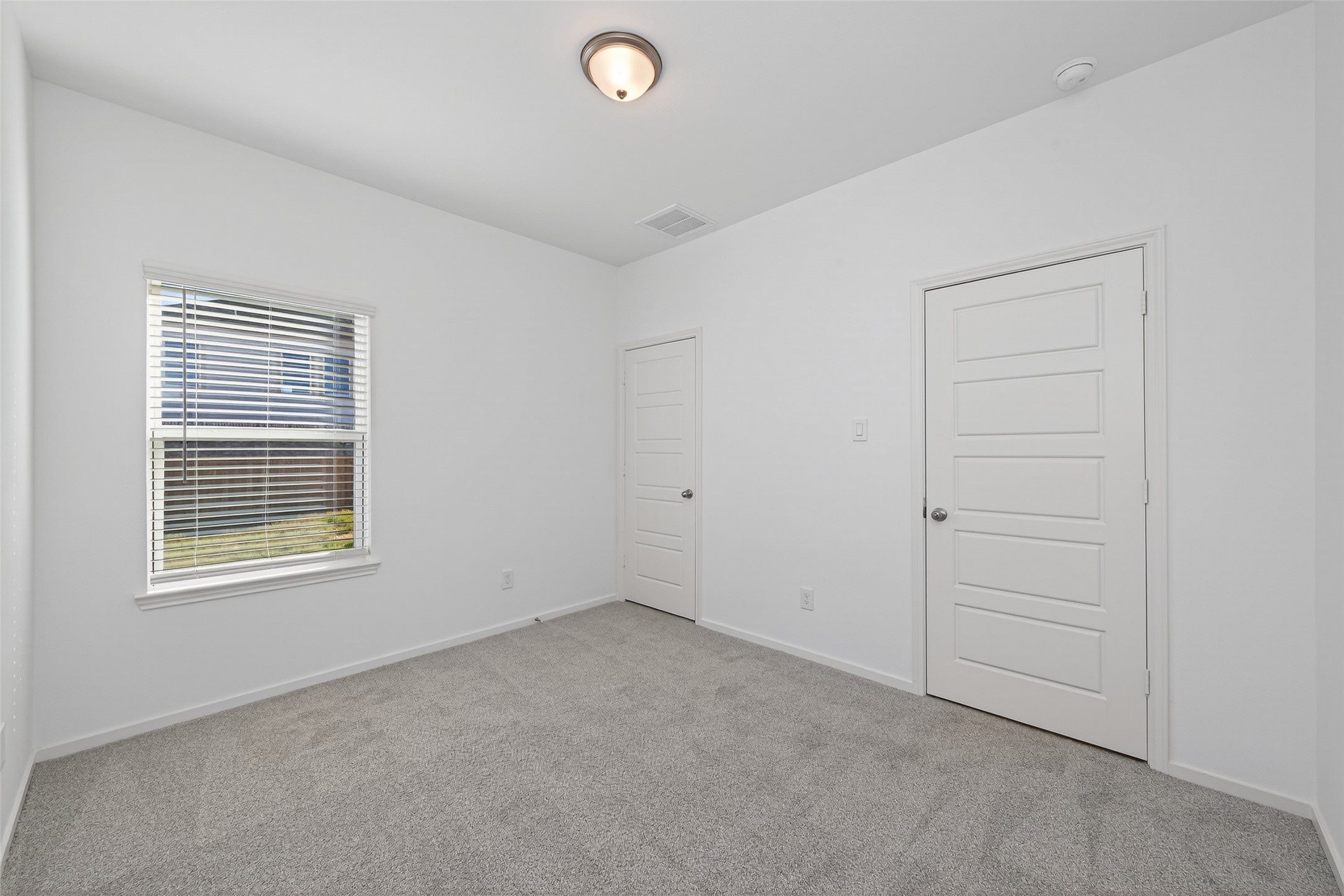 9718 Enclave Ridge Road Willis, TX 77318 - Photo 21 of 34 an empty room with a window