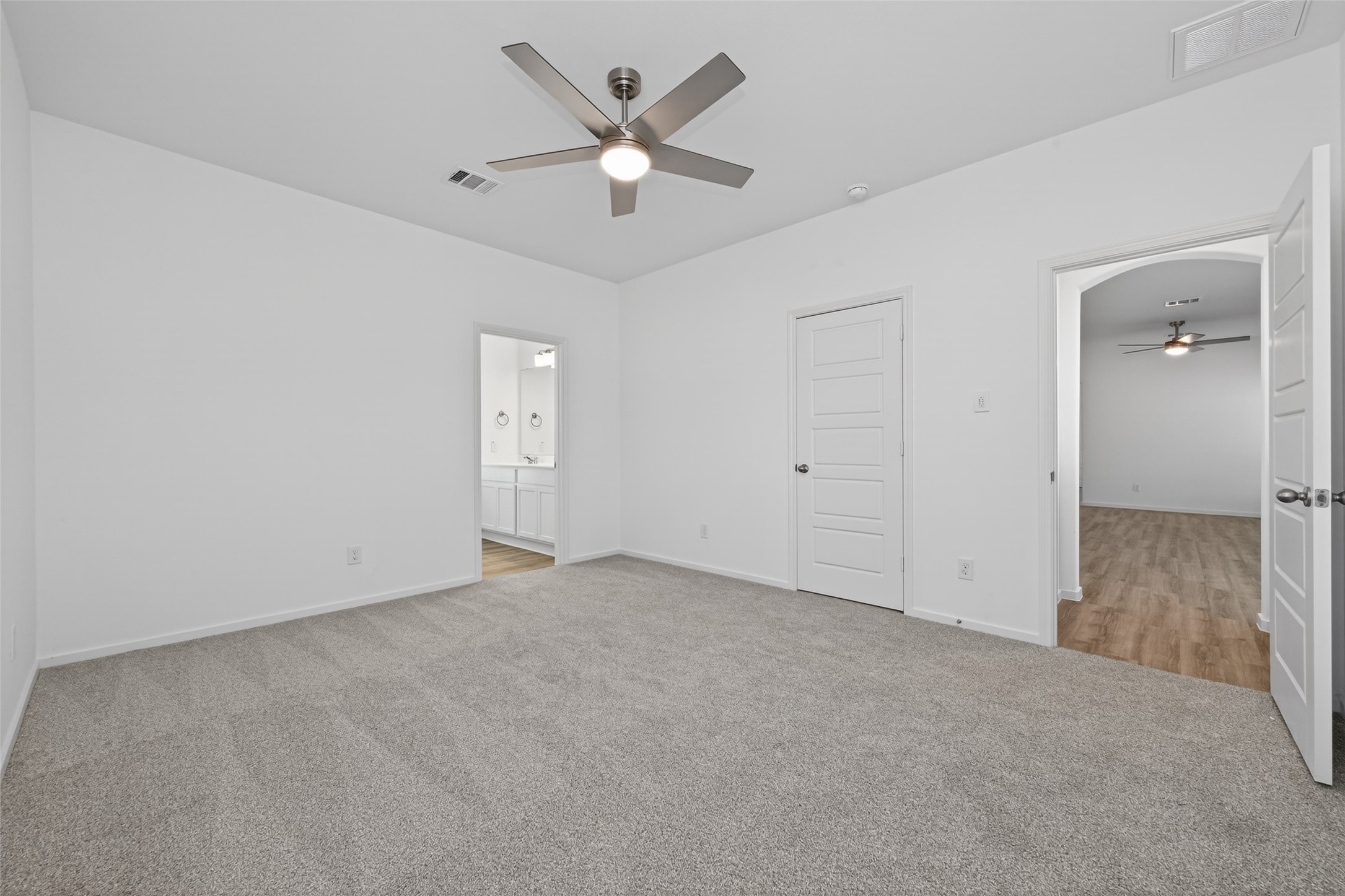 9718 Enclave Ridge Road Willis, TX 77318 - Photo 25 of 34 an empty room with a ceiling fan and a window