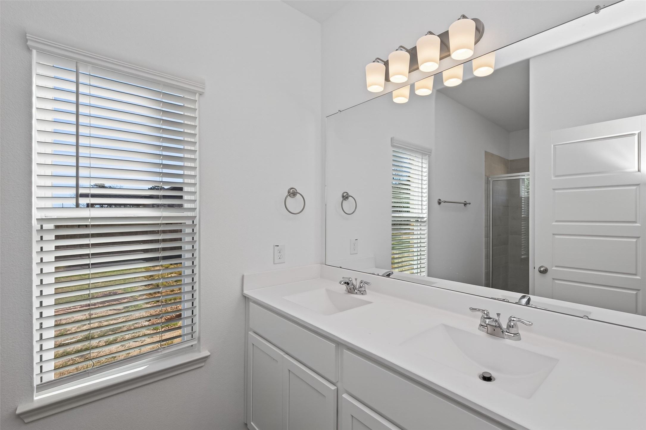 9718 Enclave Ridge Road Willis, TX 77318 - Photo 26 of 34 a bathroom with a sink a mirror and a shower