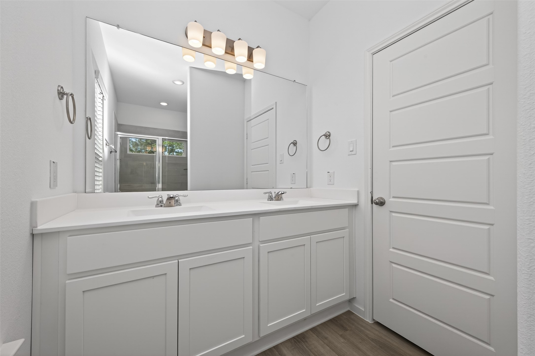9718 Enclave Ridge Road Willis, TX 77318 - Photo 27 of 34 a bathroom with a double vanity sink and mirror