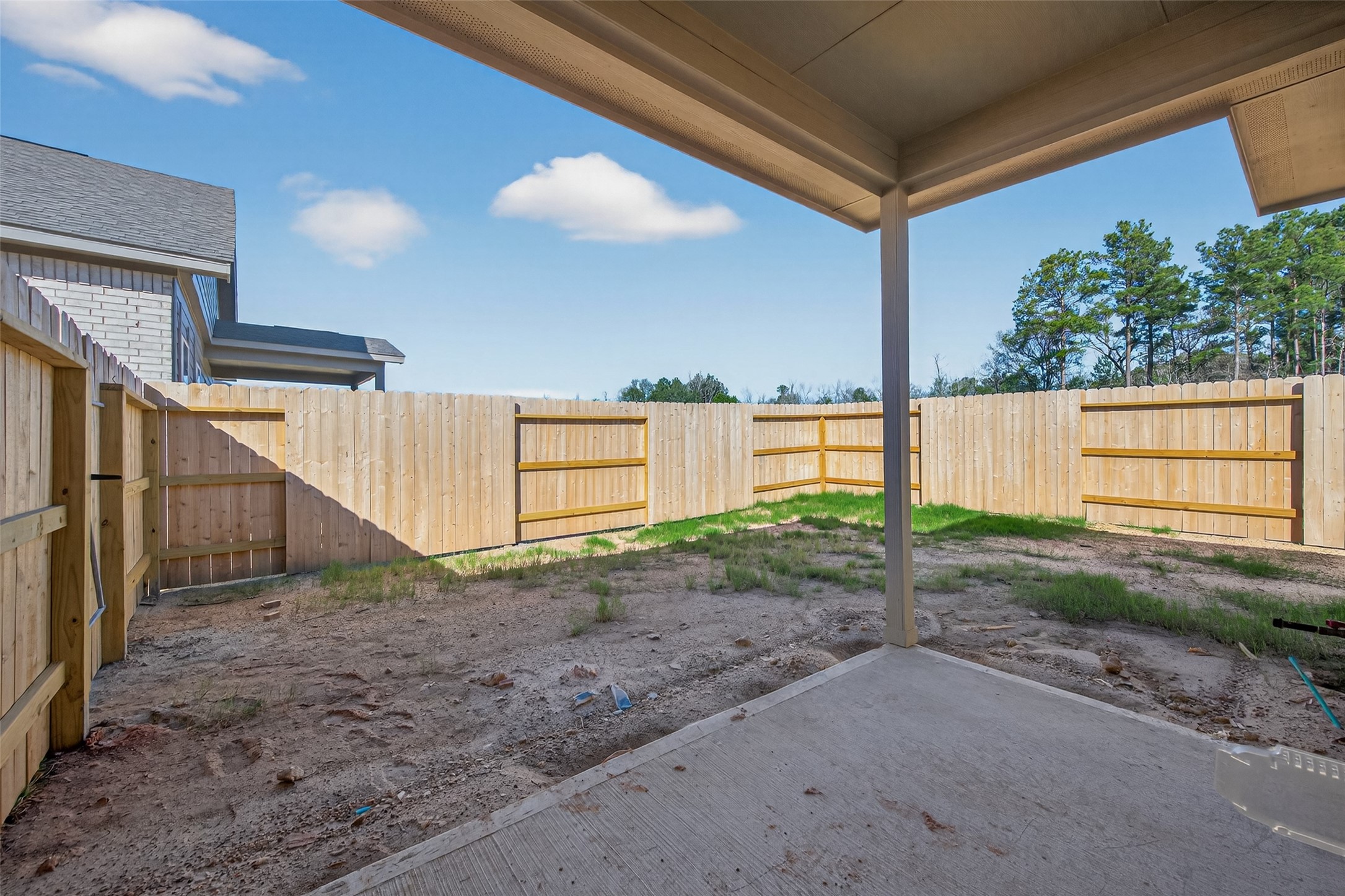 9718 Enclave Ridge Road Willis, TX 77318 - Photo 30 of 34 a view of backyard and trees