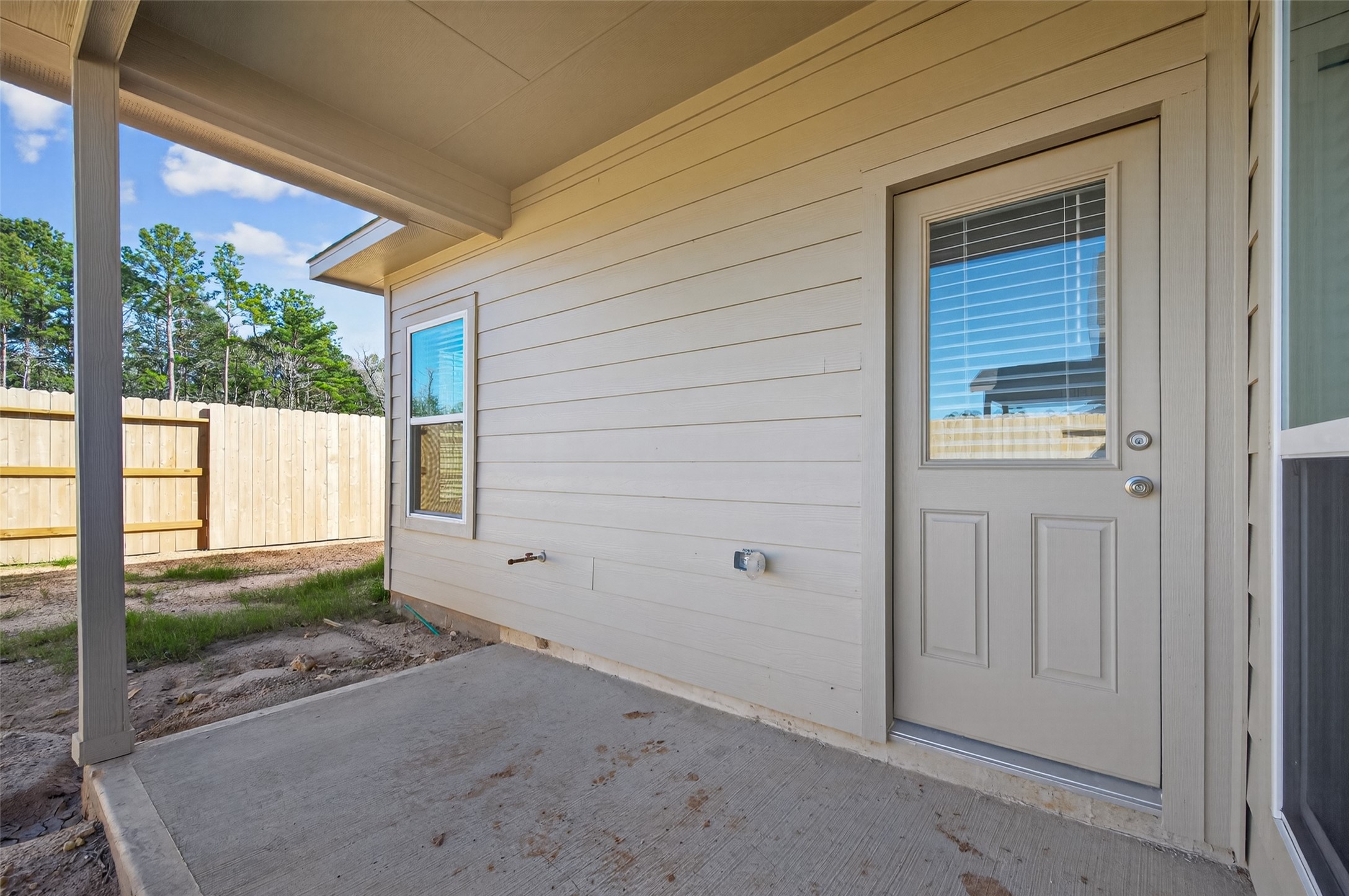 9718 Enclave Ridge Road Willis, TX 77318 - Photo 31 of 34 a view of a house with a yard
