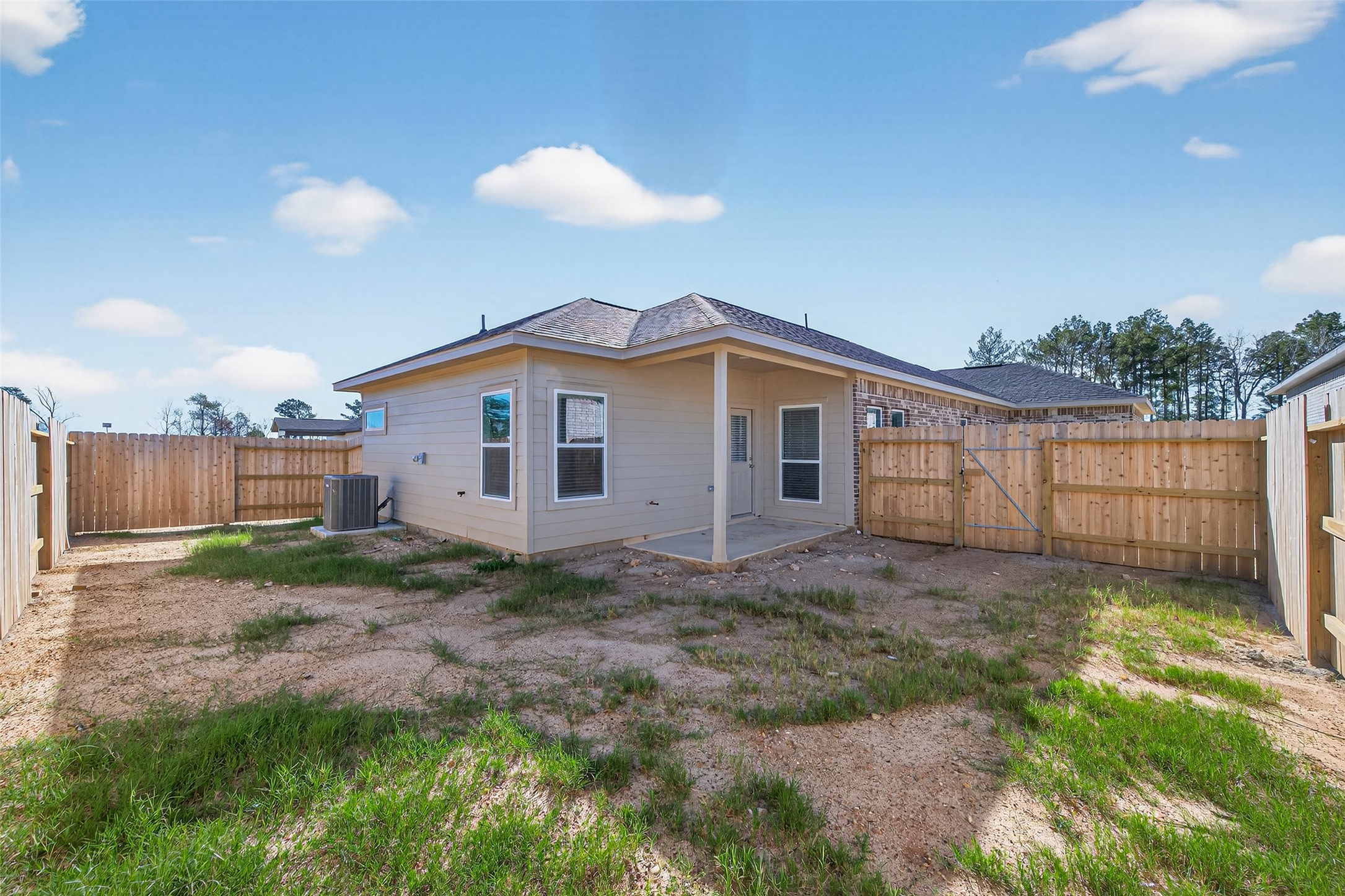 9718 Enclave Ridge Road Willis, TX 77318 - Photo 33 of 34 a view of a yard in front of a house with a large tree