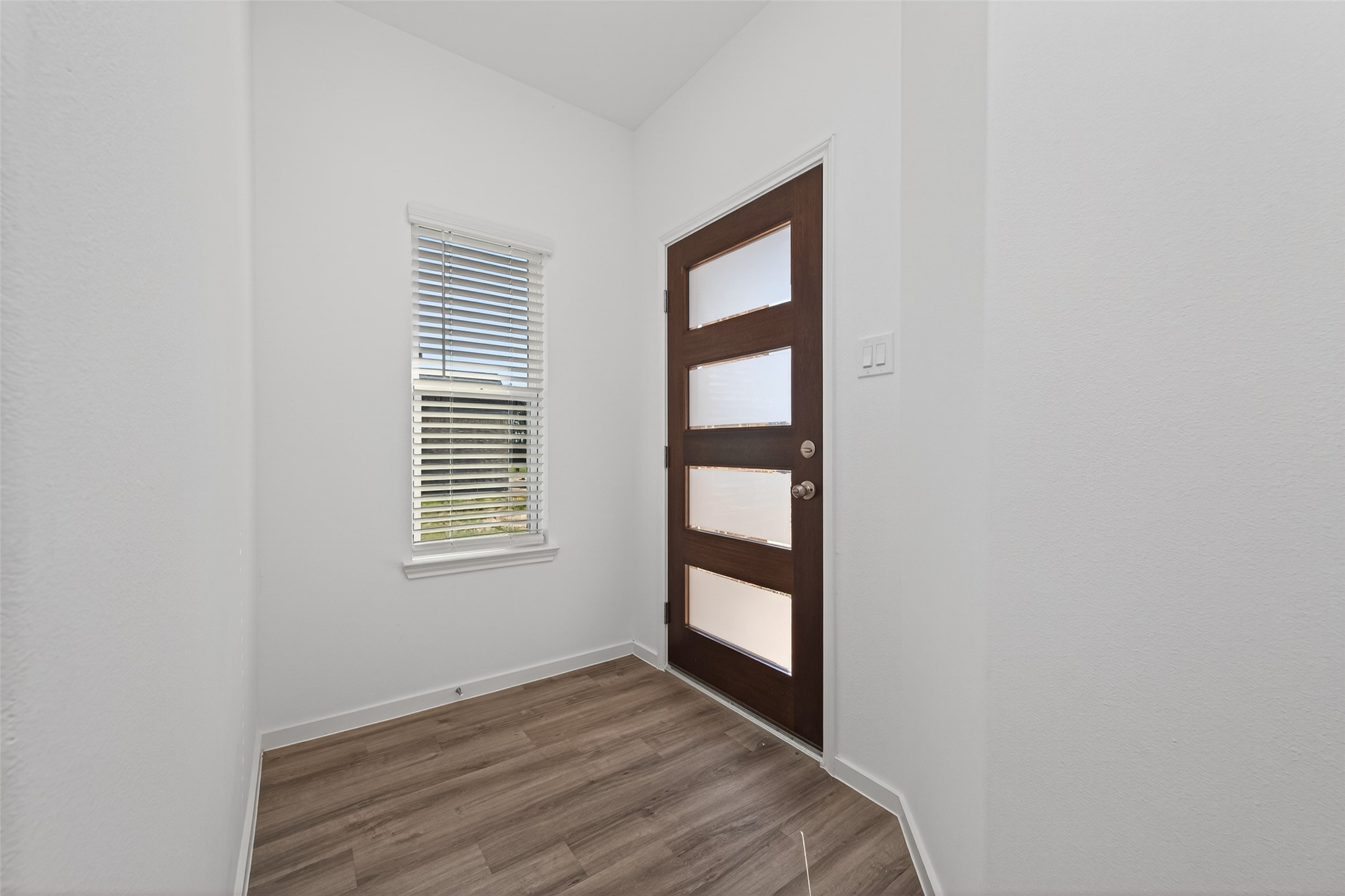 9718 Enclave Ridge Road Willis, TX 77318 - Photo 6 of 34 a view of wooden floor and windows in a room