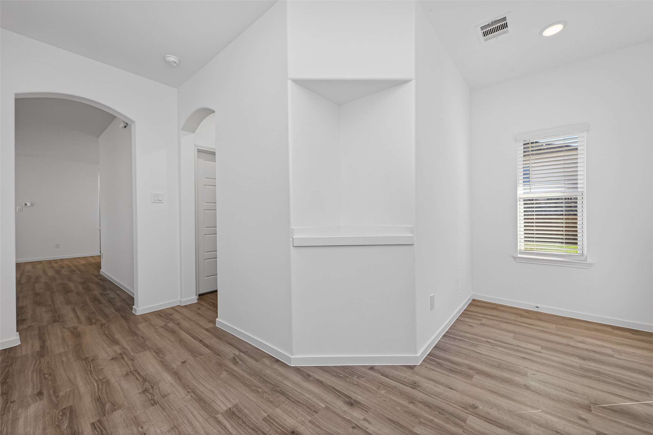 9718 Enclave Ridge Road Willis, TX 77318 - Photo 7 of 34 a view of a room with wooden floor and white doors