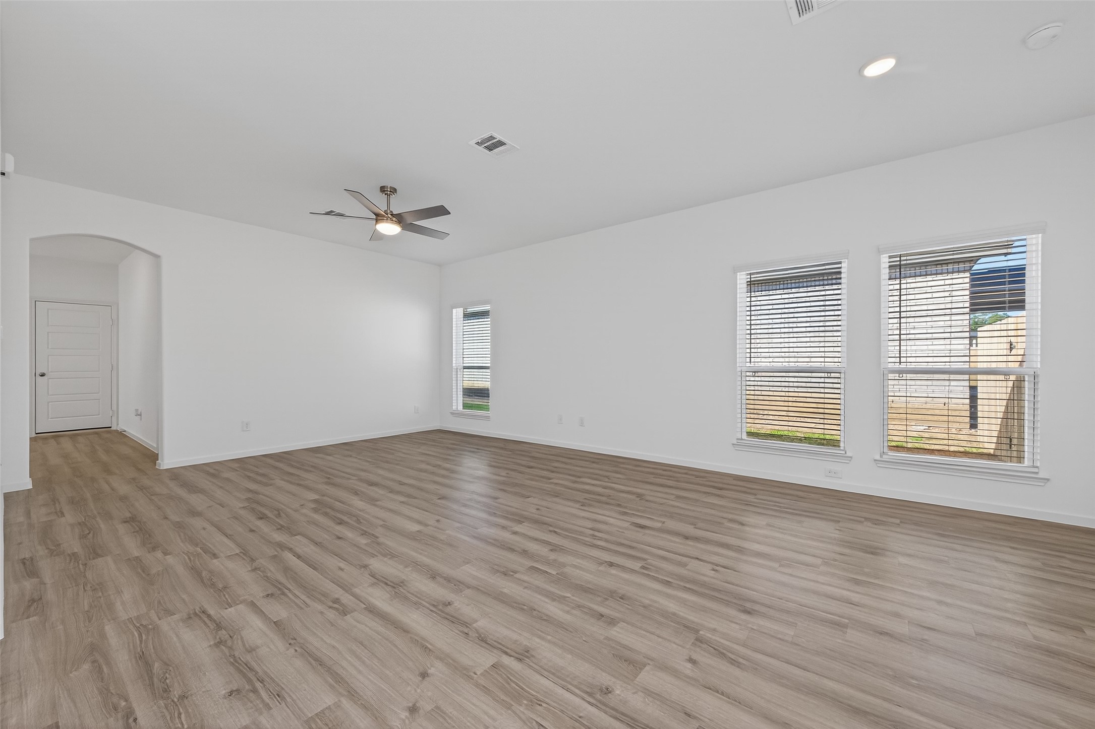 9718 Enclave Ridge Road Willis, TX 77318 - Photo 9 of 34 wooden floor in an empty room with a window