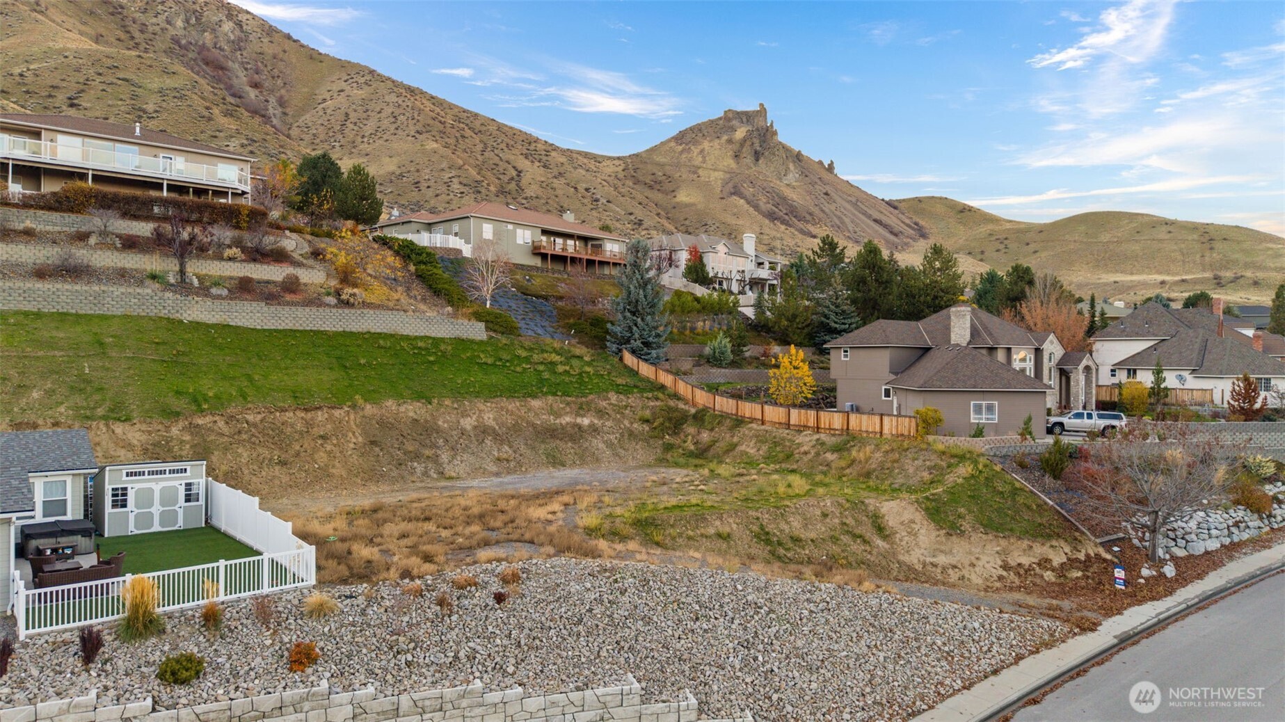 756 Castle Heights Drive Wenatchee, WA 98801 - Photo 14 of 22 a view of a town with mountains & house in the background