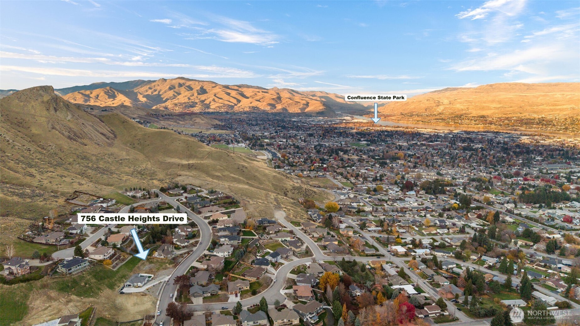 756 Castle Heights Drive Wenatchee, WA 98801 - Photo 10 of 22 a view of a city with mountains in the background
