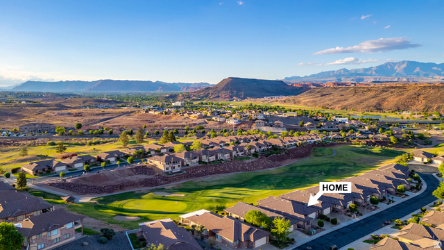 2212 Chippenham Court St. George, UT 84770 - Photo 53 of 75 Aerial view of residential area with a mountain backdrop and a local golf course