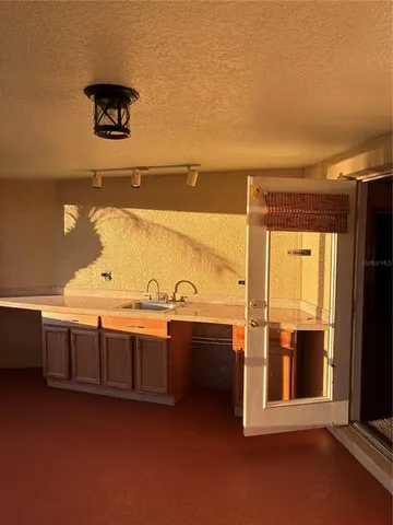 a view of a bathroom with a sink and mirror