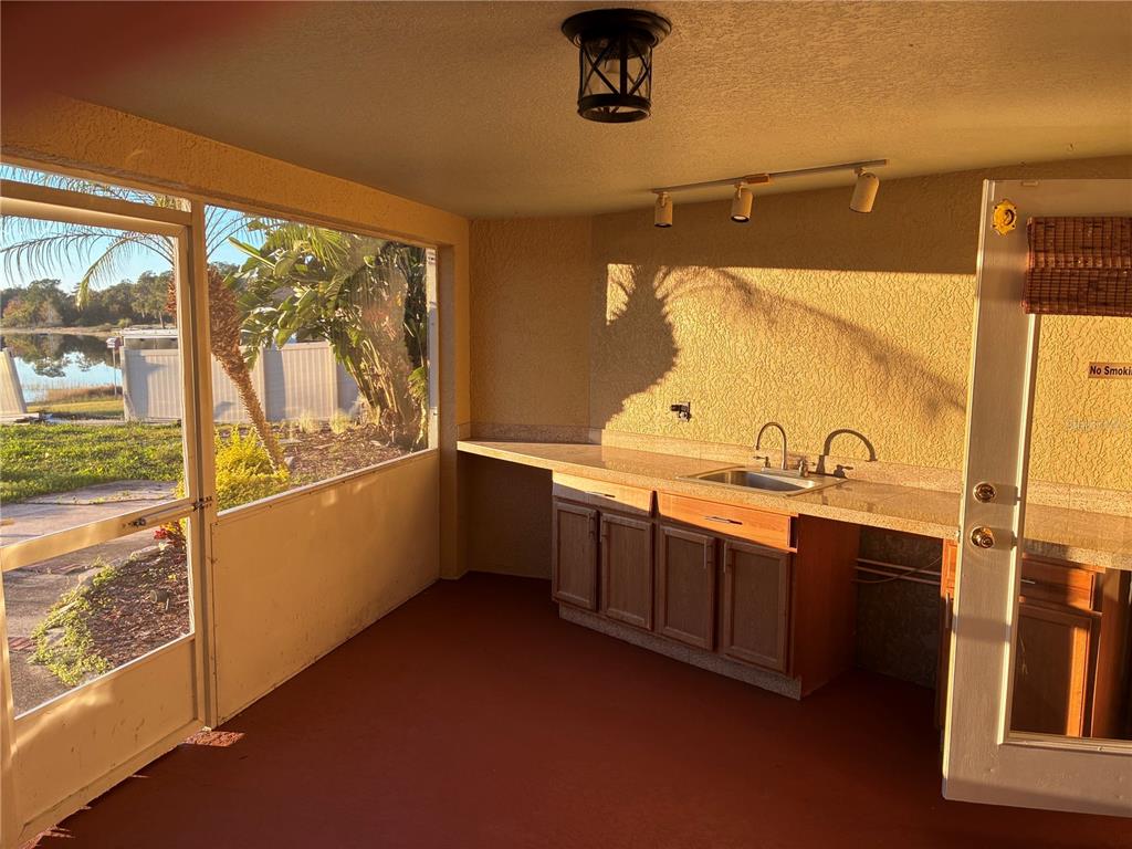 41515 Silver Drive Umatilla, FL 32784 - Photo 24 of 29 a view of a bathroom with a sink and mirror