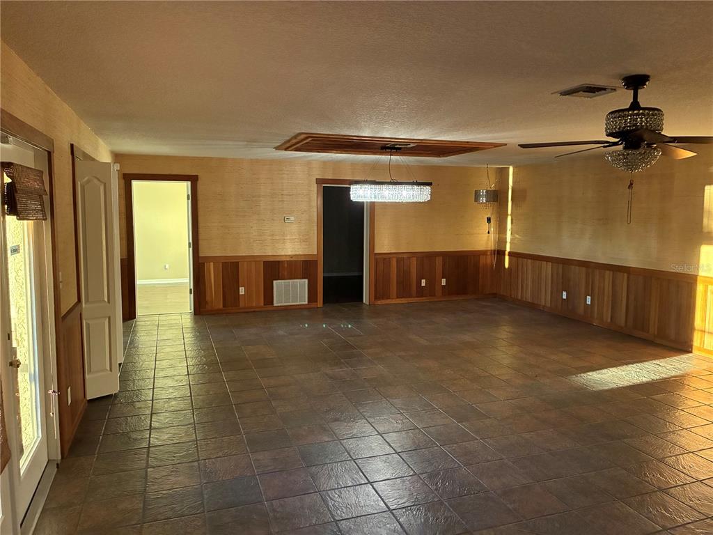 41515 Silver Drive Umatilla, FL 32784 - Photo 28 of 29 a view of a hallway with wooden shelves