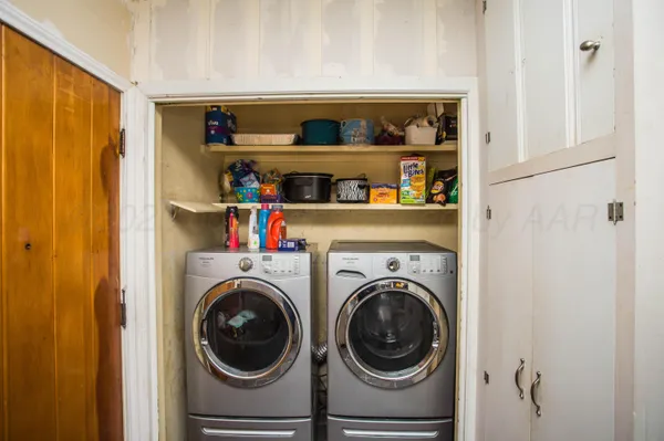 a utility room with dryer and washer