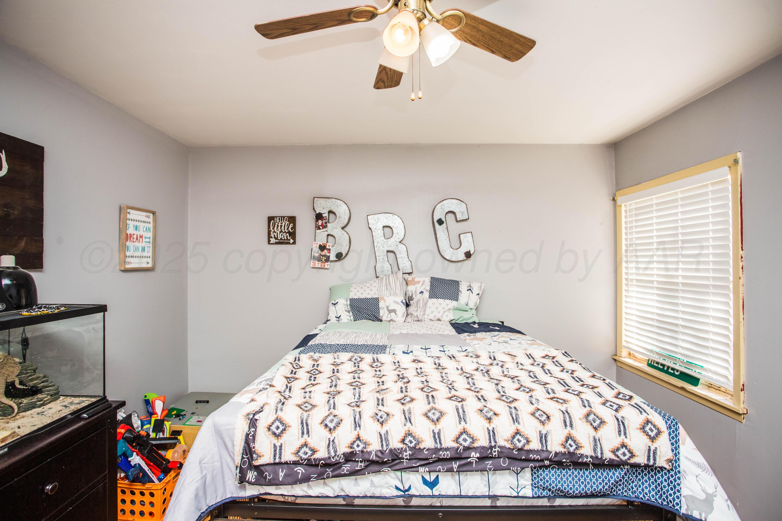 50 Fannin Drive Tulia, TX 79088 - Photo 30 of 40 a bedroom with a bed and a window