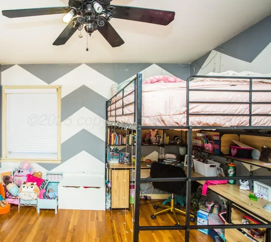 a store room with lots of clutter and flowers