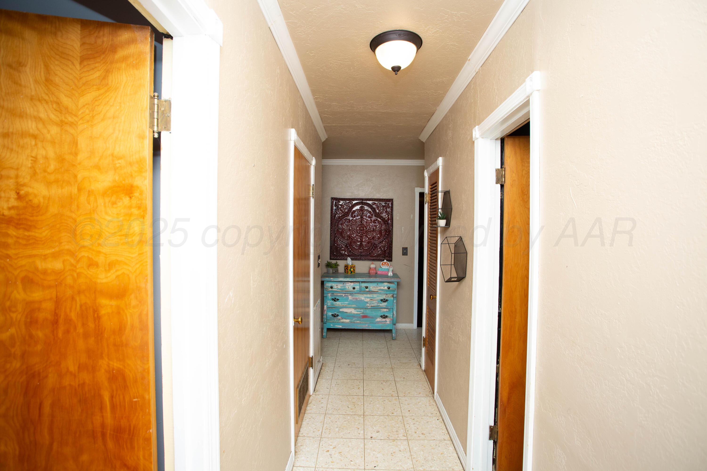 50 Fannin Drive Tulia, TX 79088 - Photo 34 of 40 a view of a hallway with interior of the house