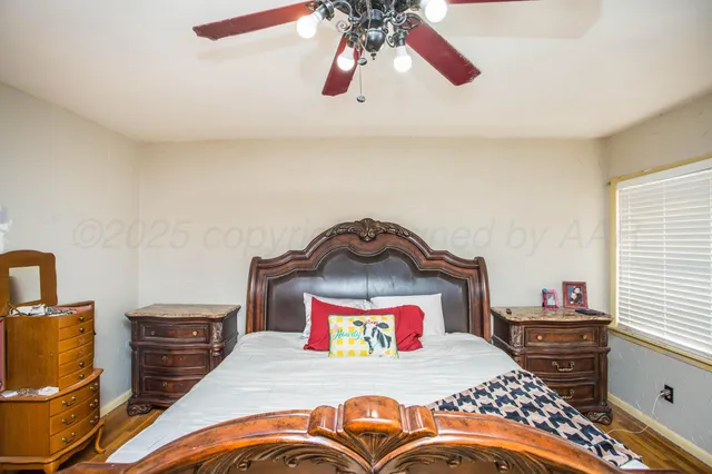 a bedroom with a bed and a dresser