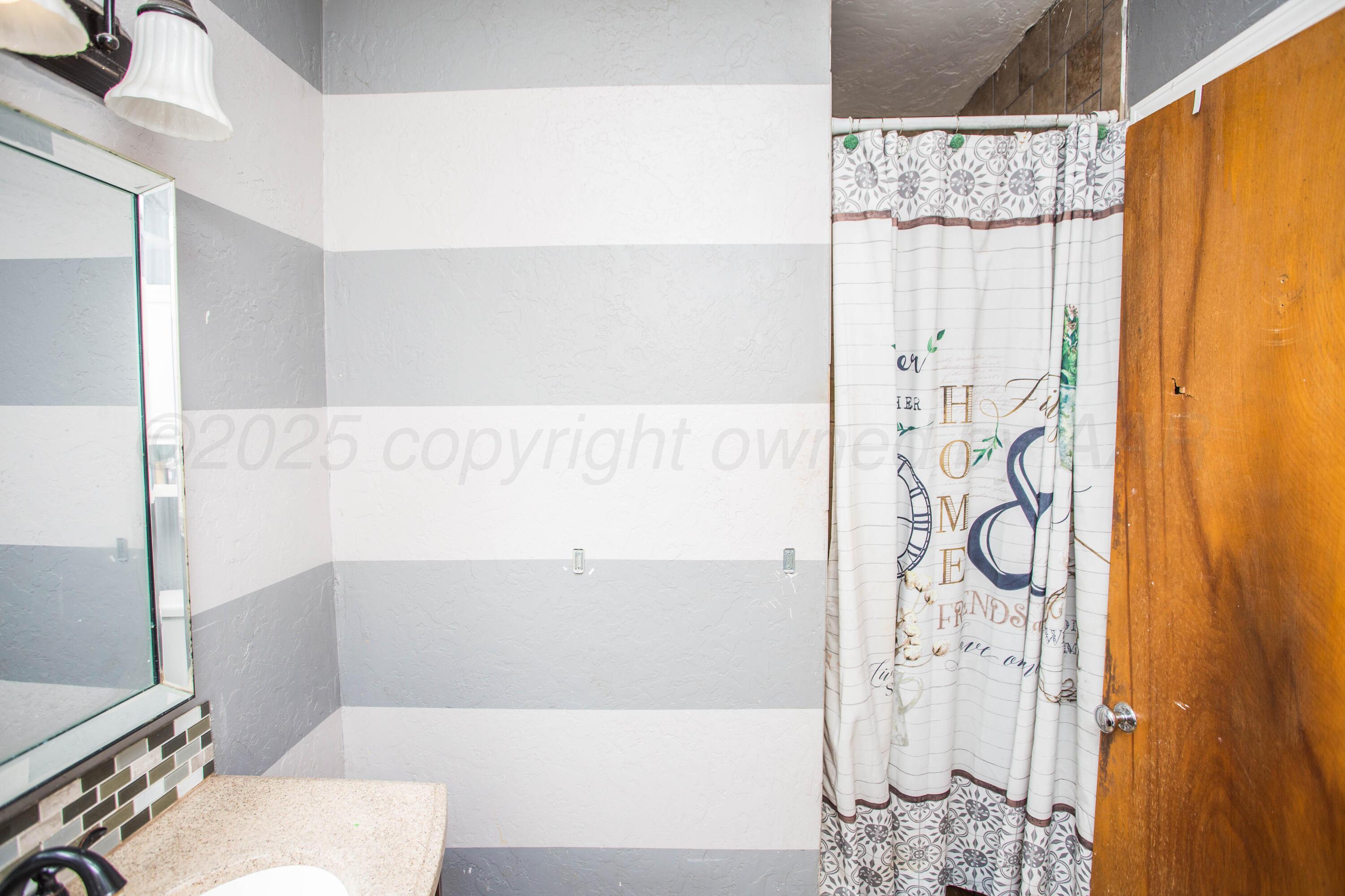 50 Fannin Drive Tulia, TX 79088 - Photo 39 of 40 a bathroom with a shower and a sink