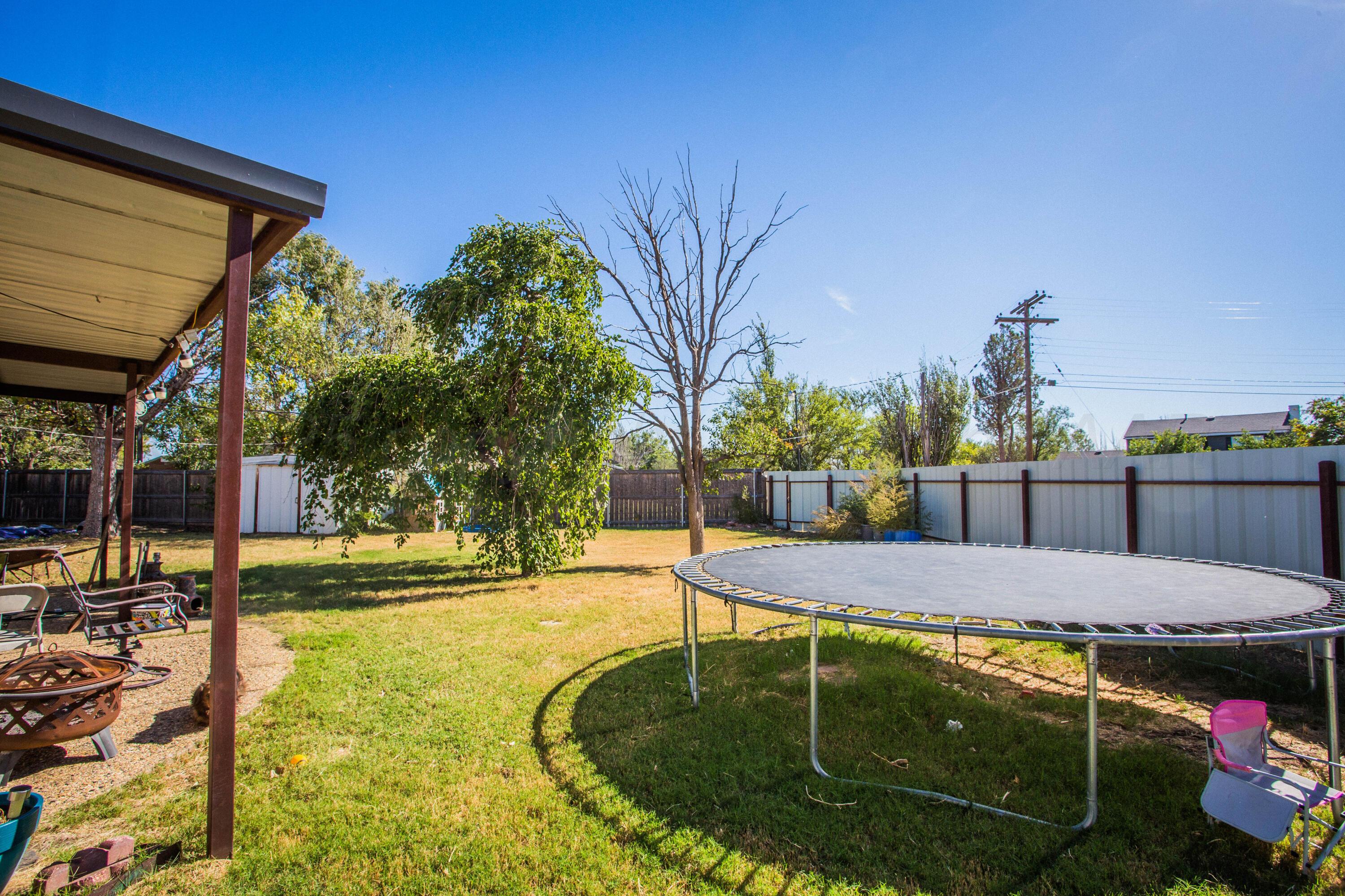 50 Fannin Drive Tulia, TX 79088 - Photo 4 of 40 a view of a swimming pool with a patio