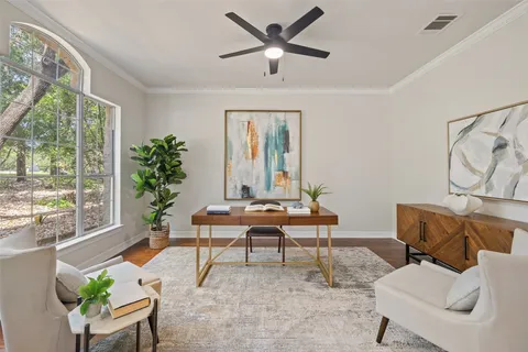 a view of a livingroom with furniture window and wooden floor