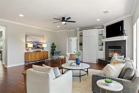 a living room with furniture fireplace and a flat screen tv