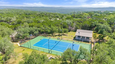 a view of a backyard with a small pool