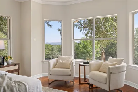 a bathroom with a bathtub a sink and a large mirror