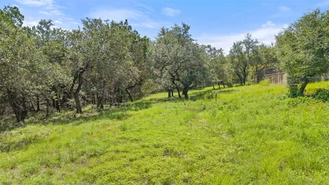 a view of swimming pool with sitting area and garden