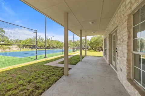 a view of a chairs and table in the patio